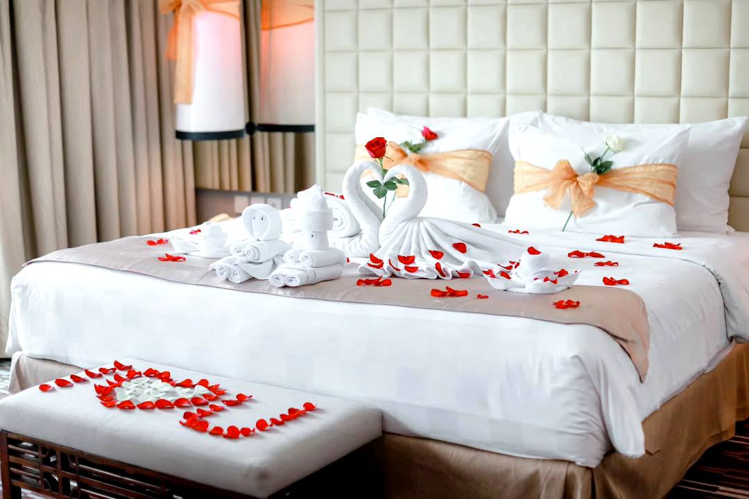 romantic decorated bed in honeymoon suite